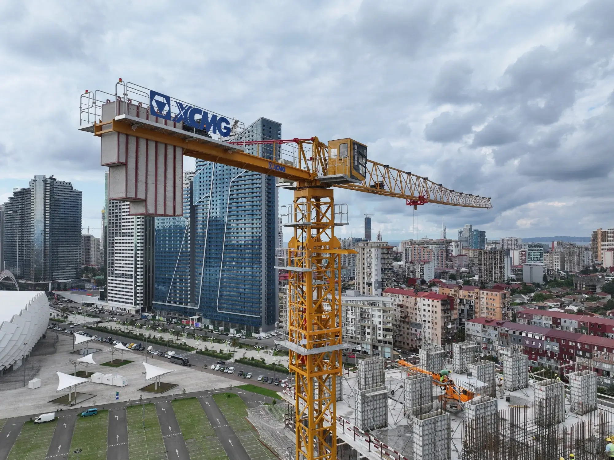 Tower cranes on active construction site for long-duration lifting